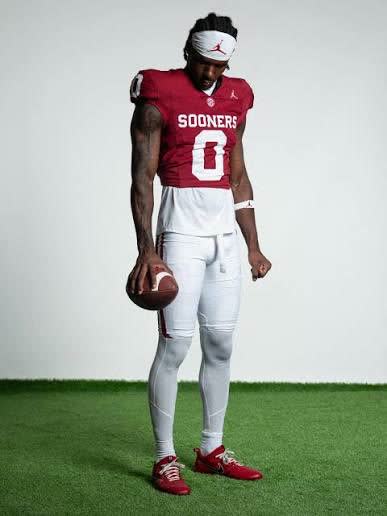 Oklahoma Sooners player, number 0, holding a football